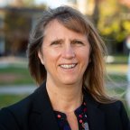 Polly Smith smiles at camera on campus at Utica College.