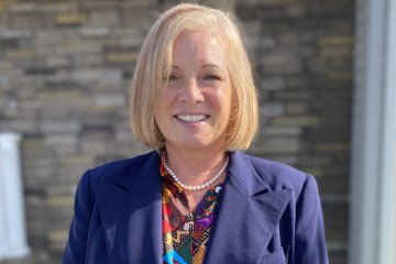 Jackie Romano smiling.