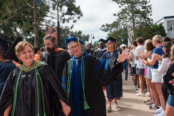 Members of the University faculty process into the Clark Athletic Center for the 2025 Convocation.