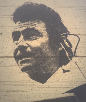 Rod Serling behind a microphone as he speaks to the Class of 1973 at Commencement.