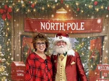 Diane Pudney with Santa Claus at the 2025 Holiday Dinner.