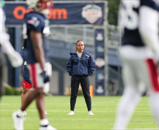 Maya Ana Callender on the field with the New England Patriots.