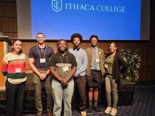 Yamilet Tavarez, Belier Javier, Brian Kusi, Xavier Moore, Jallen Wright, and Kira Maddox stand together at the 2024 CNY LSAMP Symposium.