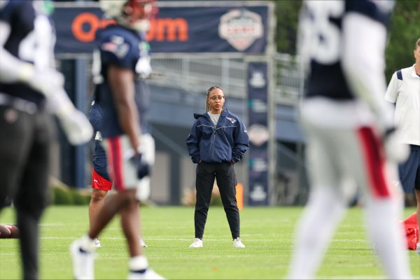 Maya Ana Callender on the field with the New England Patriots.