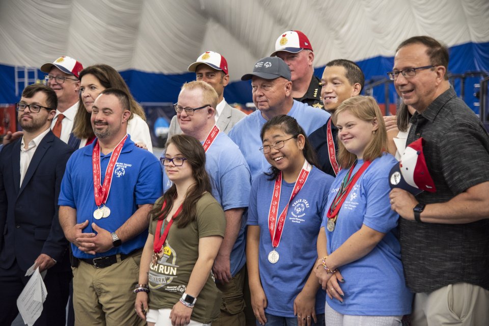 Members of the NYS Special Olympics pose with local politicians.
